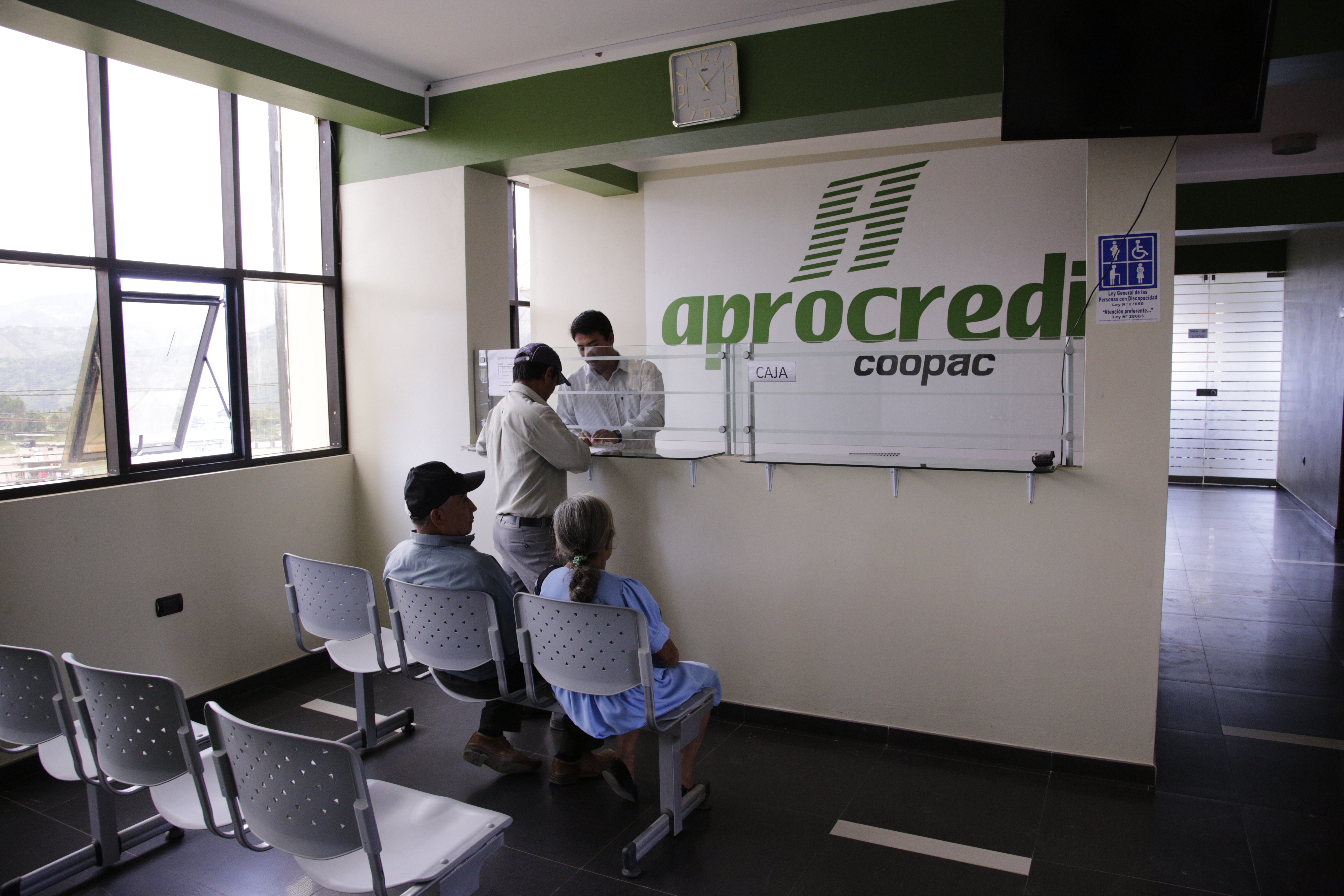 Members of APROCASSI, a coffee cooperative in Peru, line up to apply for credit from the cooperative's internal credit fund.