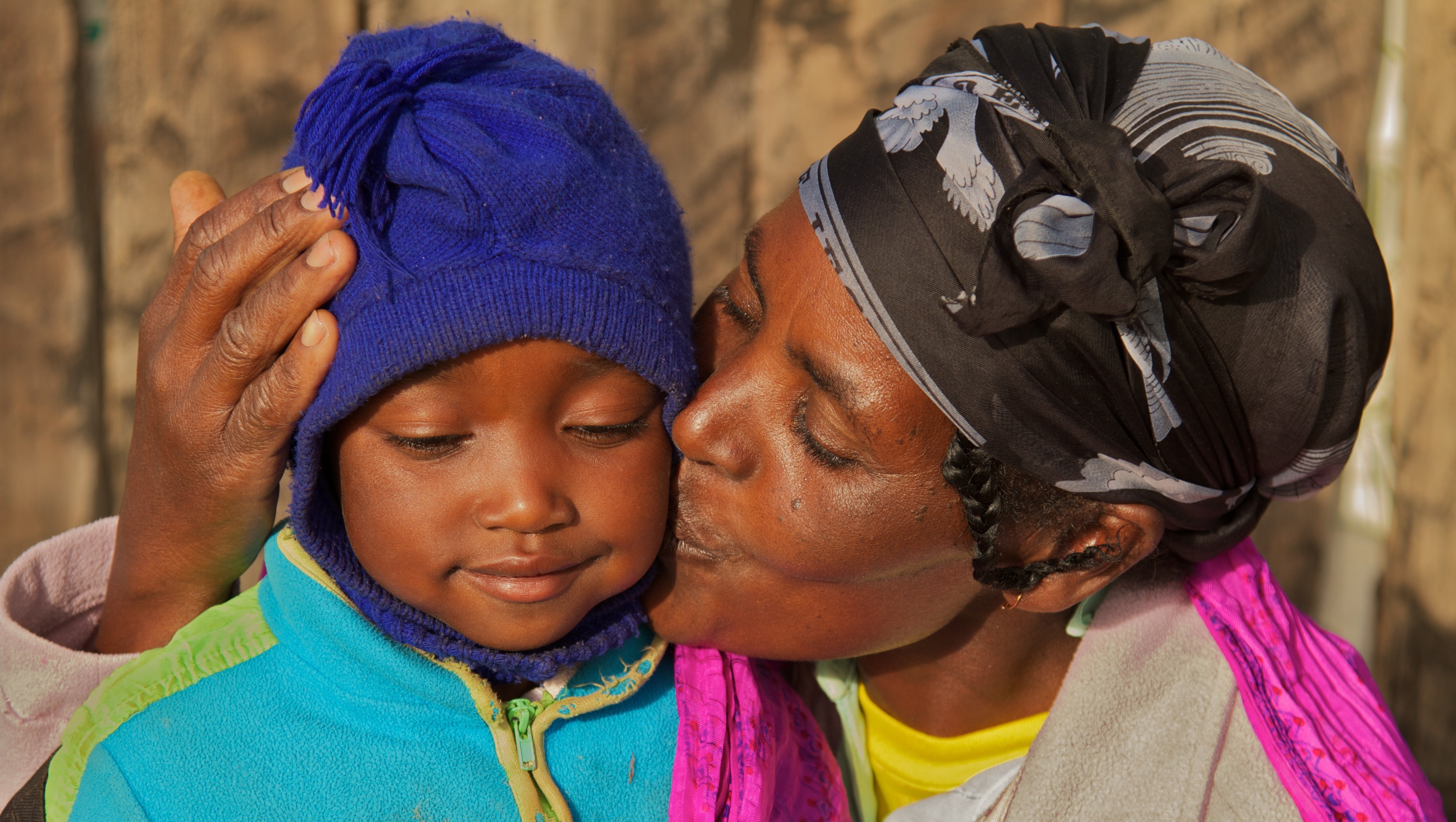 A Kenyan farmer and her child.