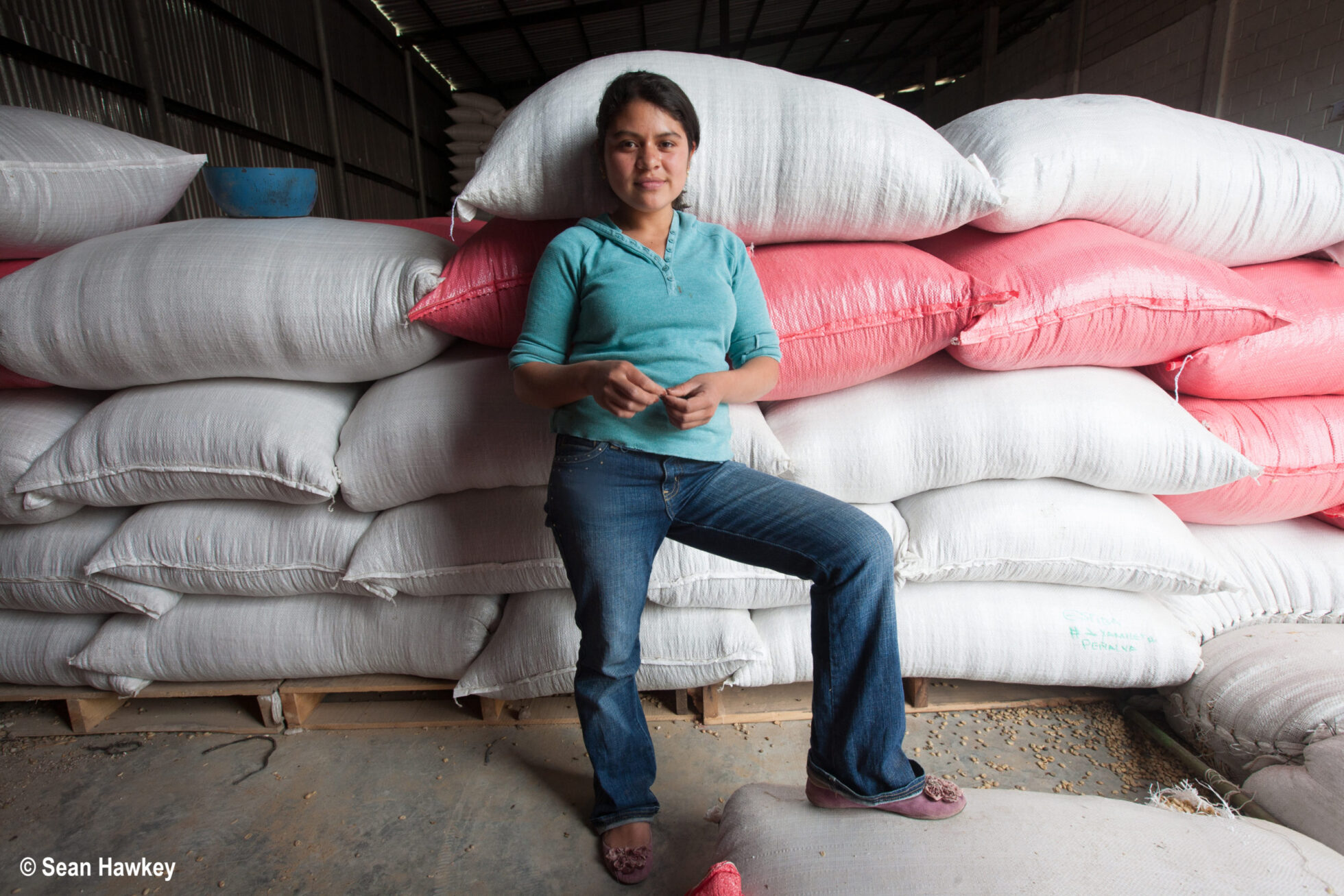 Female worker running a warehouse for a coffee cooperative in Honduras