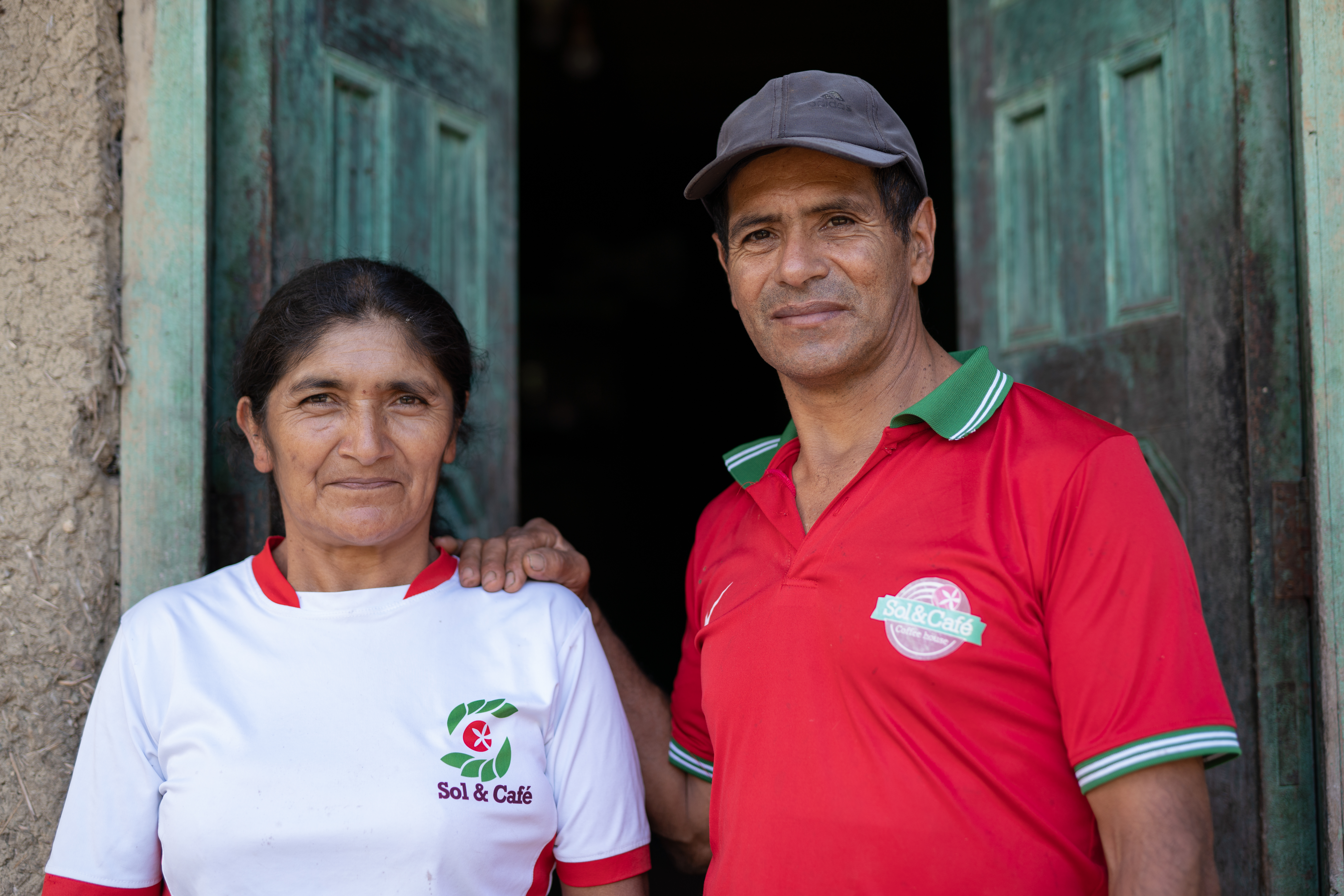 Sol&Cafe producer member, Jose Renulfo Perez, in front of his home along with his wife Filomena Bernal, 56. El Nogal, Jaen, Cajamarca, Peru. October 9, 2022. Credit: James Rodriguez