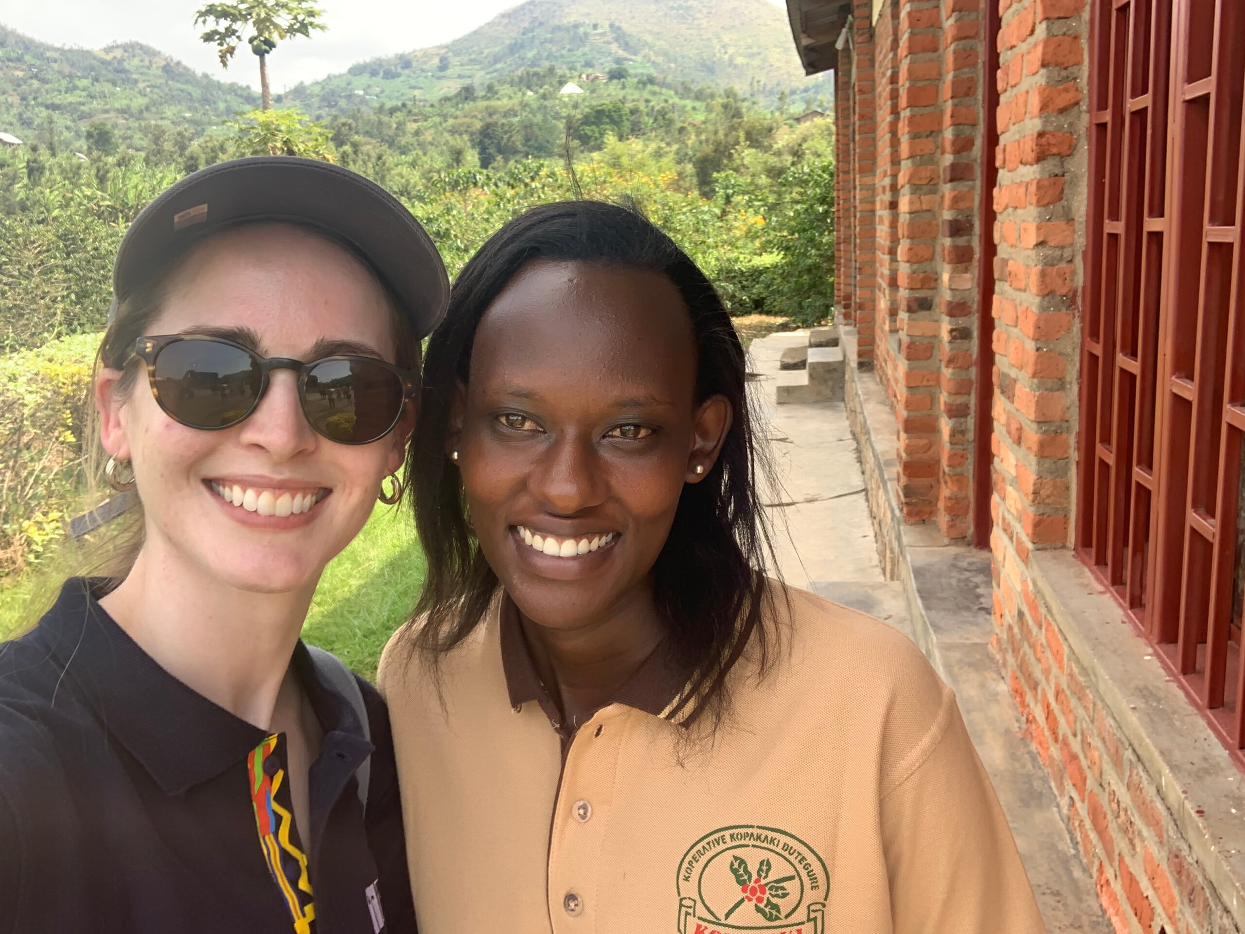 Julia Diegel, Root Capital’s Senior Director of Supporter Engagement, alongside Jeannette Mukayisenga, a Talent Partner who is now a full-time employee at KOPAKAKI-Dutegure in Mabanza, Rwanda, 2023. Credit: Root Capital.