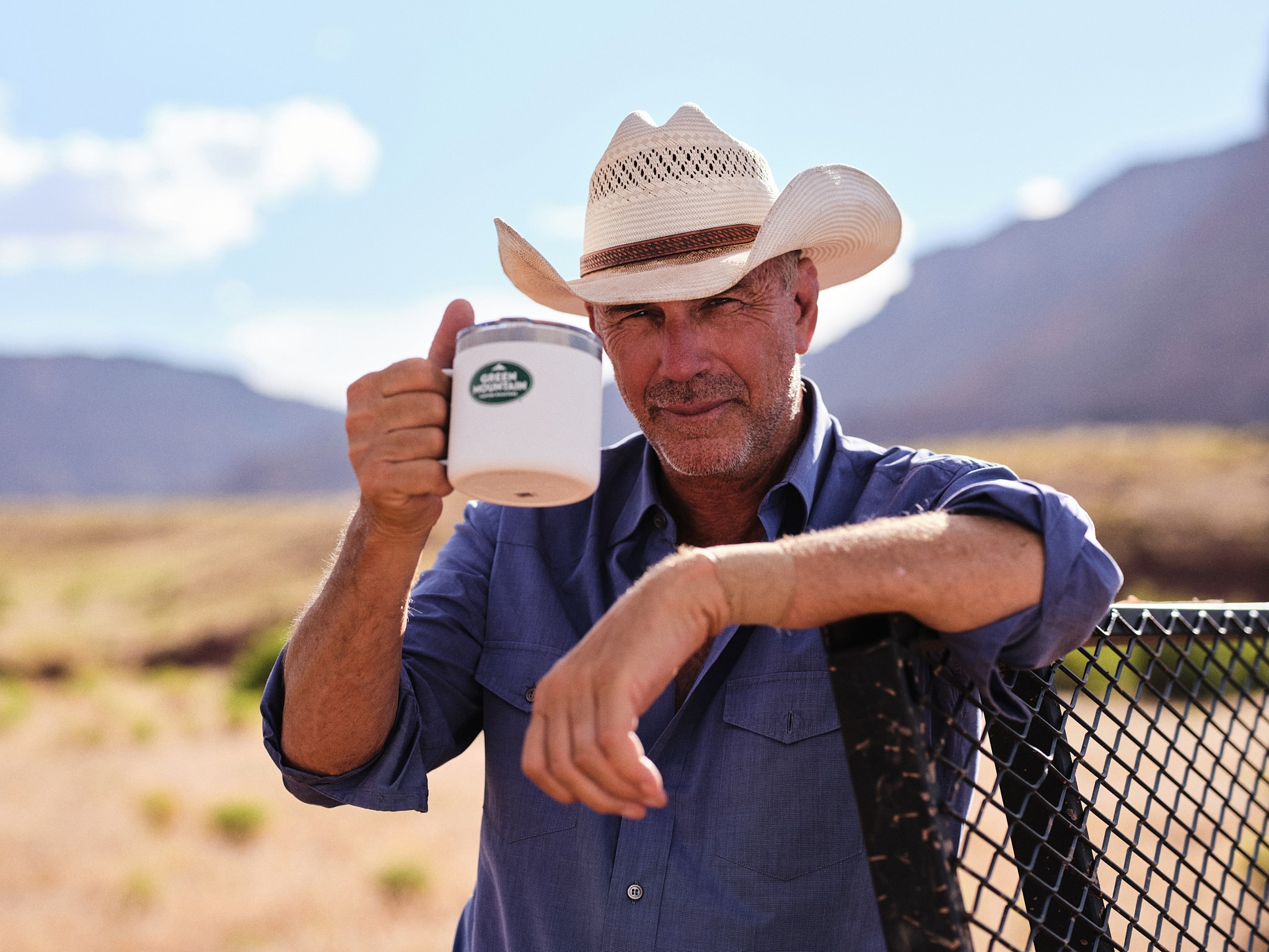 Kevin Costner raises a Green Mountain Coffee Roasters mug in celebration of Green Mountain Coffee Roasters's new "Horizon Blend by Kevin Costner" coffee line. Photo credit: Green Mountain Coffee Roasters.